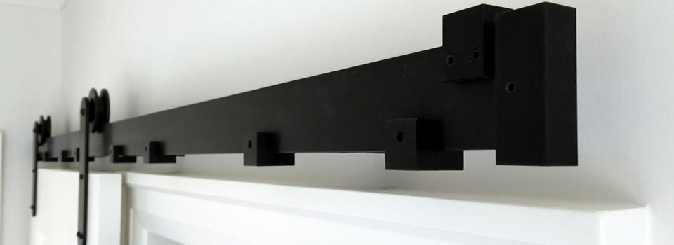 Mikron black barn door rail hardware detail